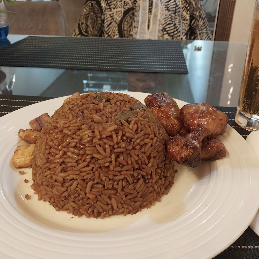 Jollof rice with glazed chicken and plantain